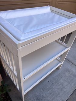 white wooden baby changing table/changing station