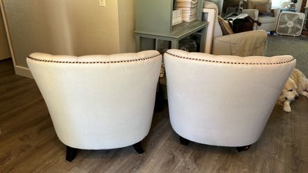 Pair of Cream Tufted Barrel Accent Chairs