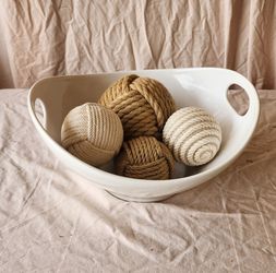 Decorative white bowl with natural jute and cotton rope balls