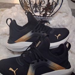 Puma Black and Gold Sneakers