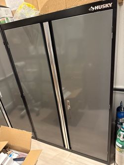 Two husky storage cabinets