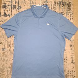 Microfiber polyester light blue short-sleeve Nike Dri-FIT polo shirt, designed primarily for golf or tennis. Nike's signature Dri-FIT technology, high