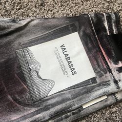 Mens size 34paint valabasas jeans never worn.