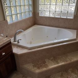 Corner Whirlpool Bathtub with Jets + Custom Tile Surround 
