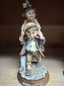 Giuseppe Armani figurine titled "Piggy Back Ride"