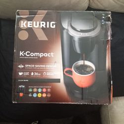 A NEW COFFEE MAKER IN THE BOX.