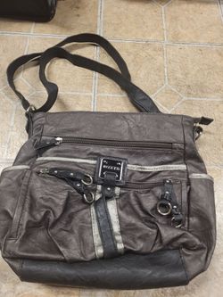 Spacious black shoulder bag with multiple compartments.