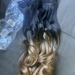 Hair extension with attached hair clips 