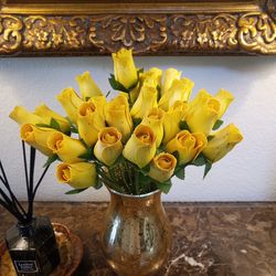 Yellow wood like roses in gold vase