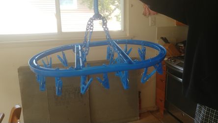 Plastic baby clothes holder