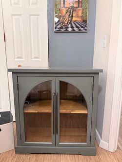 Glass Door Cabinet – $100