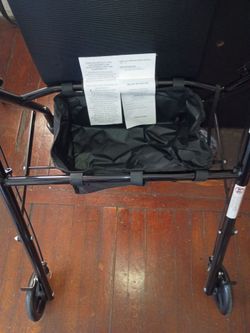 Brand new Walker with seats and compartments under seats