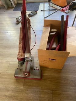 Vintage Kirby vacuum with accessories and attachments