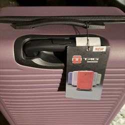 NEW ( has been stored) TAG TRAVEL LUGGAGE