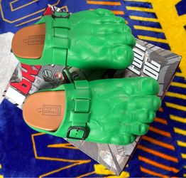 These are Bravest Studios Green Hulk Foot Clogs, featuring a molded green design with an adjustable metal buckle.