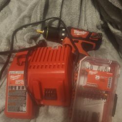 Milwaukee Drill/ Driver 3/8 Plus Charger/1 Rechargeable Battery And 25 PC Bit Set