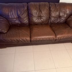 Brown leather couches, no scratches, no tears