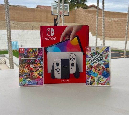 Nintendo Switch Oled with super Mario party and Mario kart deluxe 8 floor model