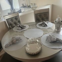 A table gray with four chairs