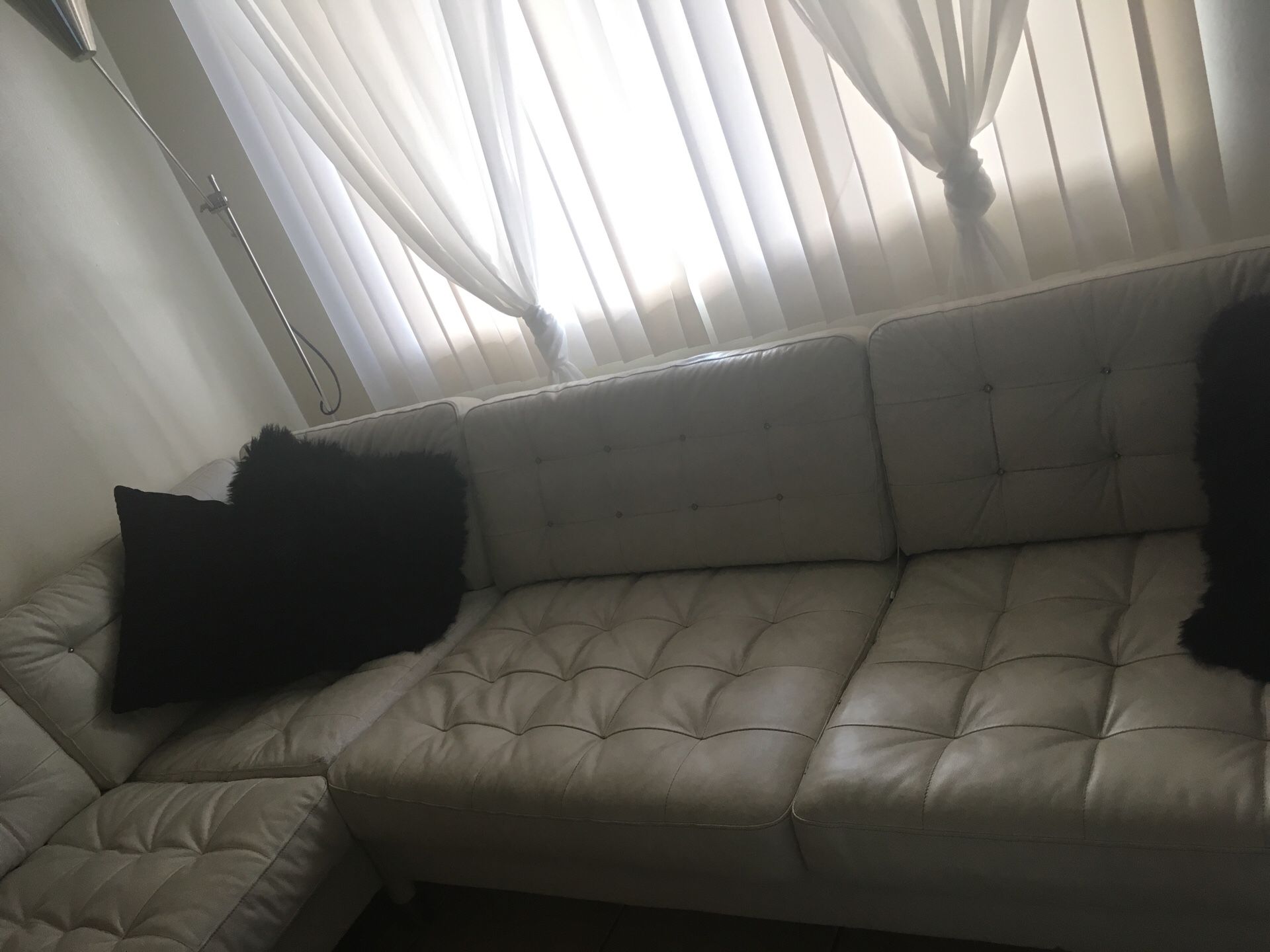 Real Leather White Button Tuffed L shaped couch.