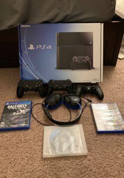 PS4 with headset, controllers and 3 games .