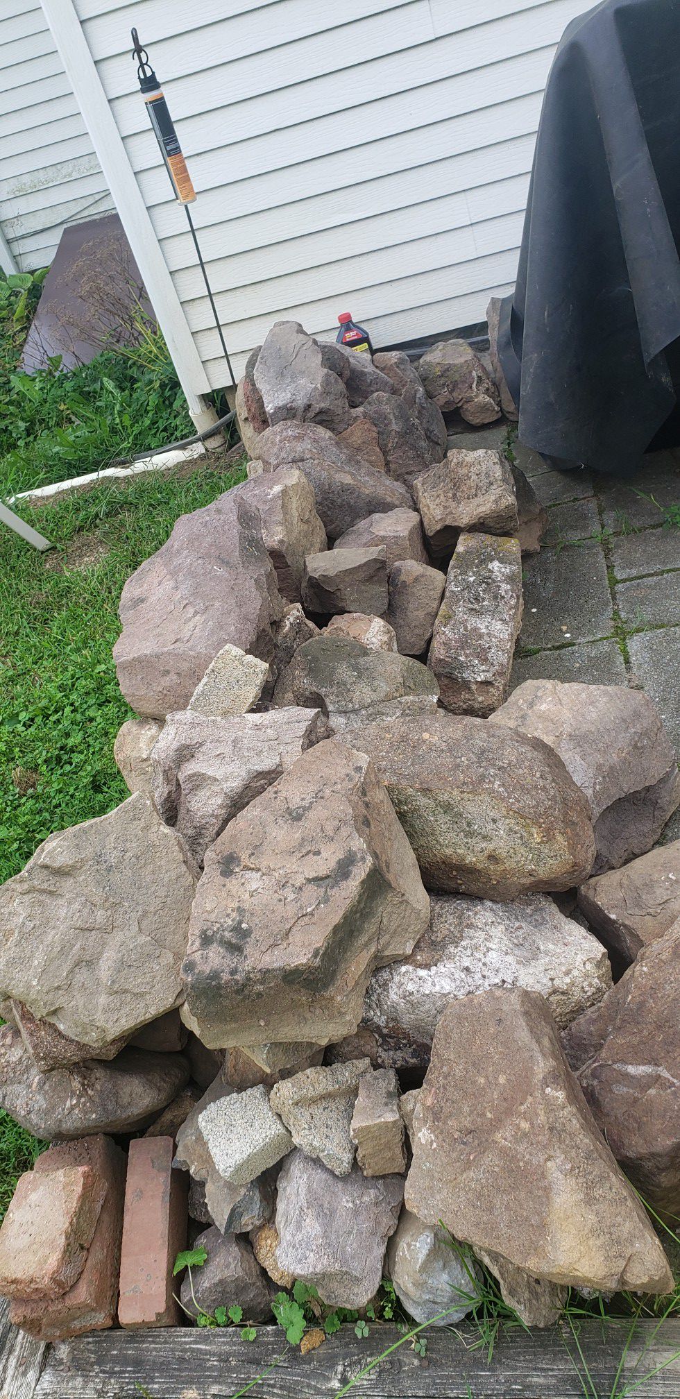 ROCKS LANDSCAPING OR WALL BUILD REDDISH IN COLOR