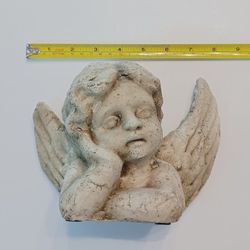 Plaster Cherub in thought