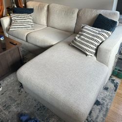 White Living Spaces 94" Sectional Sofa with Reversible Storage Chaise 