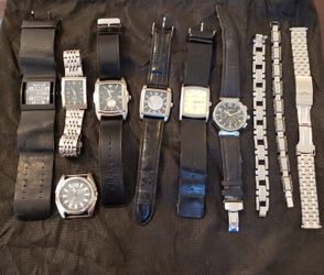 Variety of mens watches and bracelets