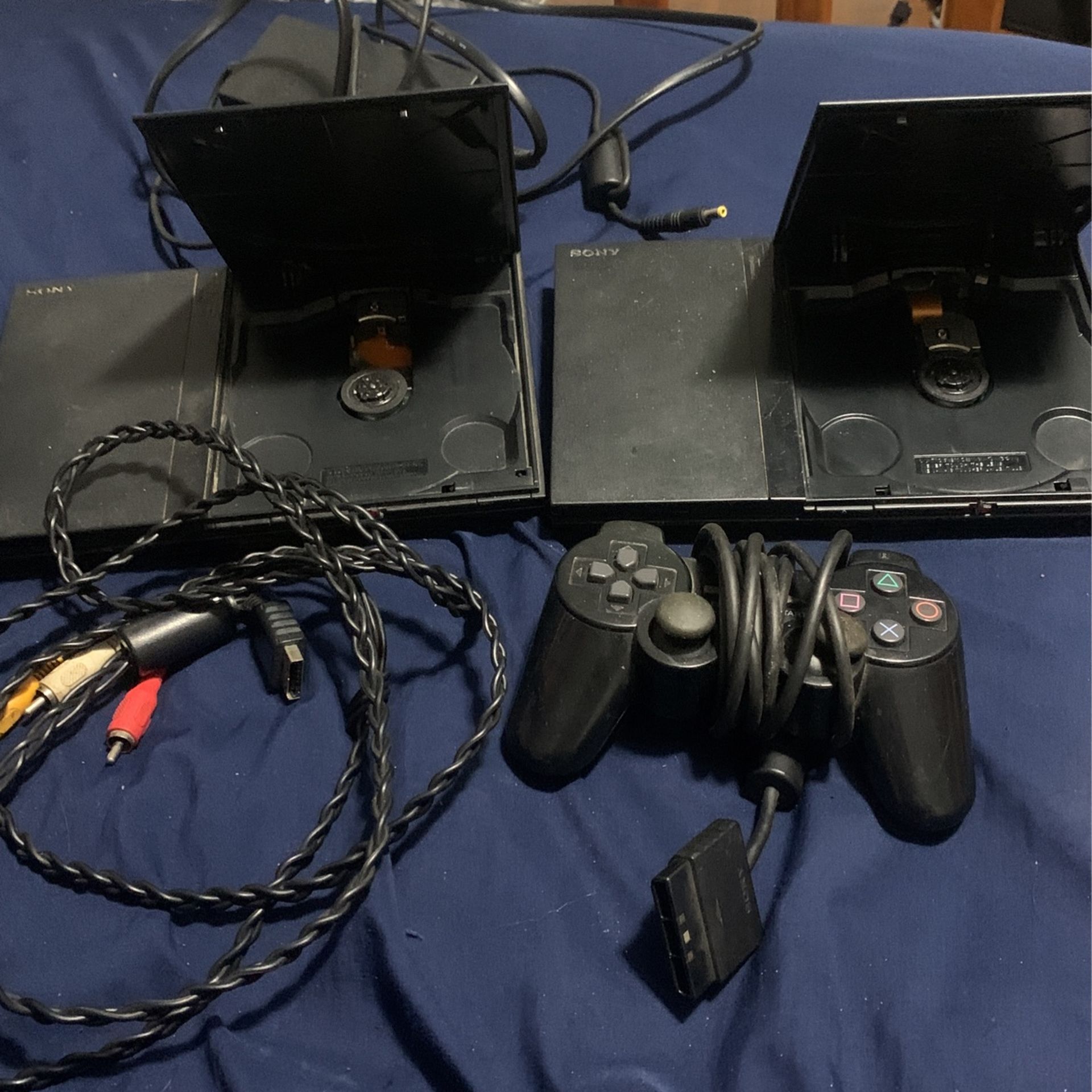 2 PlayStation slim Consoles