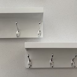 White coat hooks with shelves
