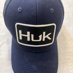 Superior fit design, a structured with buckram, mid-profile trucker with 3D embroidery Huk logo on fabric patch. Featuring a dark gray under visor to 