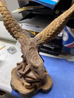 Hand carved wooden eagle on a rock18x14 and indian head 12x7
