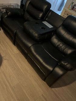Black leather recliner with outlets for charging phone