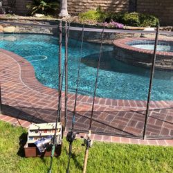 Three Fishing Rods with Casting Reels{Quantum,Abu Garcia,Dam Quick) Plus a Tackle Box