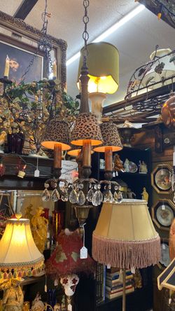 Vintage antique style crystal chandelier with leopard shades.