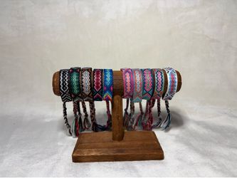 Handmade colorful string bracelets made with care by S&D Studios.