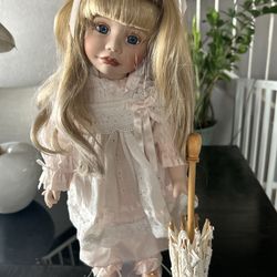 Vintage porcelain collectible doll “Heather” by artist Joke Grobben (1992).