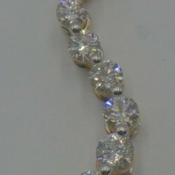 14kt yellow gold pendant “journey “ with round and baguette diamonds (3 carat approximately) super Mint. 8 round diamonds - 0.40;0.33;0.27; 0:23; 0.19