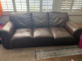 Two 8 ft by 3 ft leather sofas