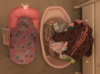 Baby clothes and bath tub