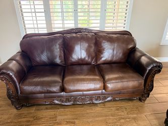 Brown leather sofa couch