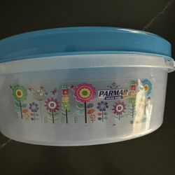 Clear plastic round storage containers with red, blue or pink lids. 