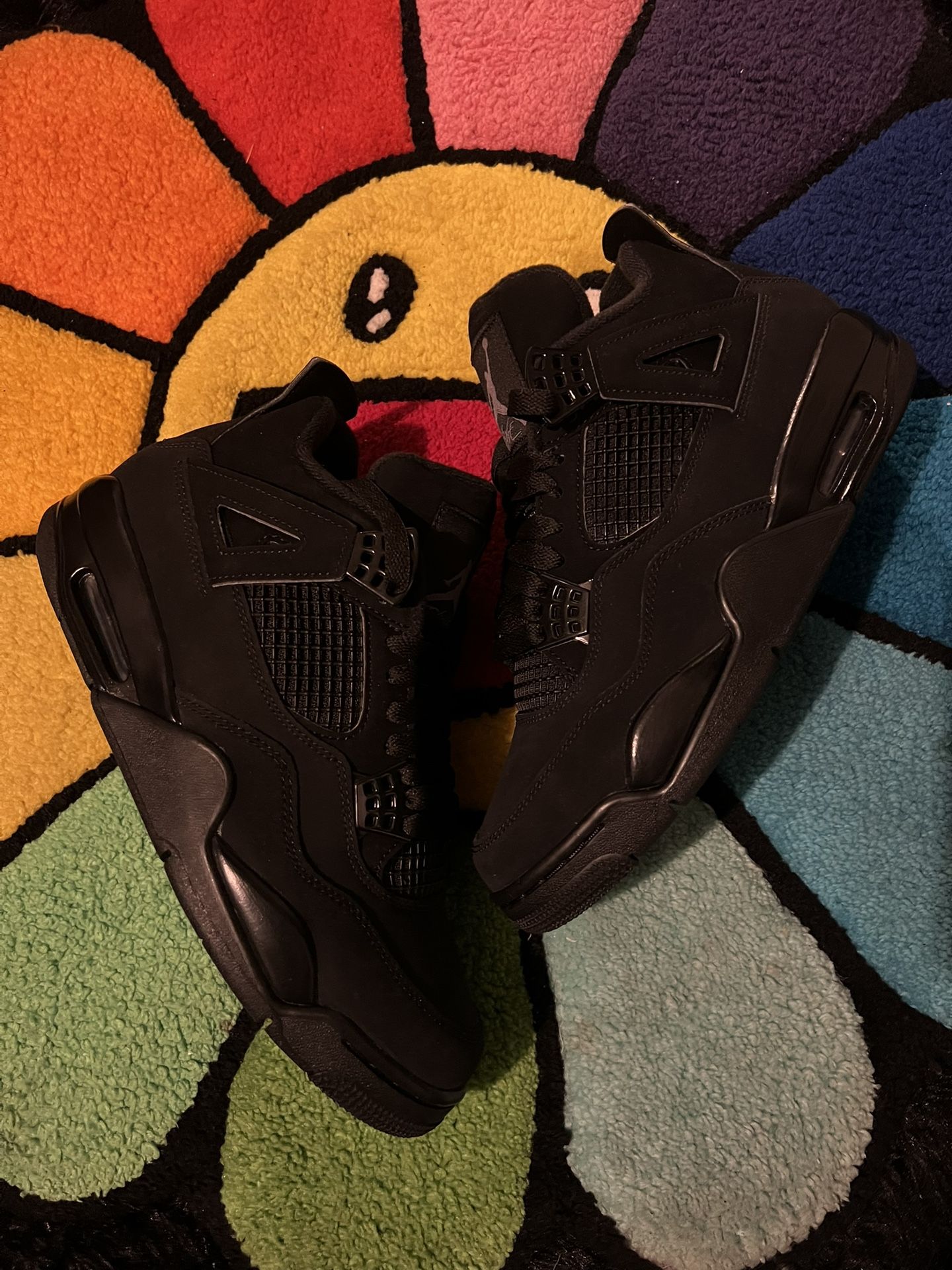 black cat jordan 4s