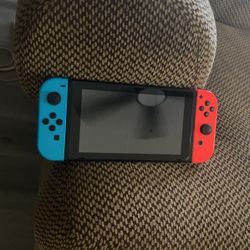 Nintendo Switch With Neon Blue And Neon Red Joy-cons