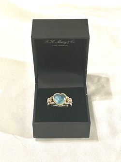 Brand new 18 karat gold & .925 silver ring with 4 diamonds & heart shaped aquamarine. Size 7.