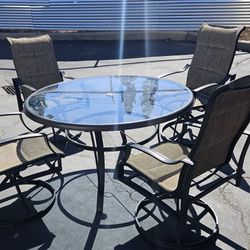 4 Outdoor Swivel Chairs With Outdoor Glass Table 