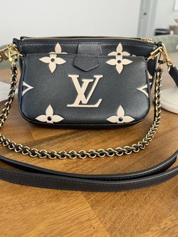 Women’s luxury black & beige handbag; Louis Vuitton