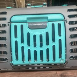 Collapsible Travel Dog/Cat Crate  Compact Collapsible Travel Dog/Cat Crate, Clean and gently used.  Light weight, and sturdy. Can be used for a small 