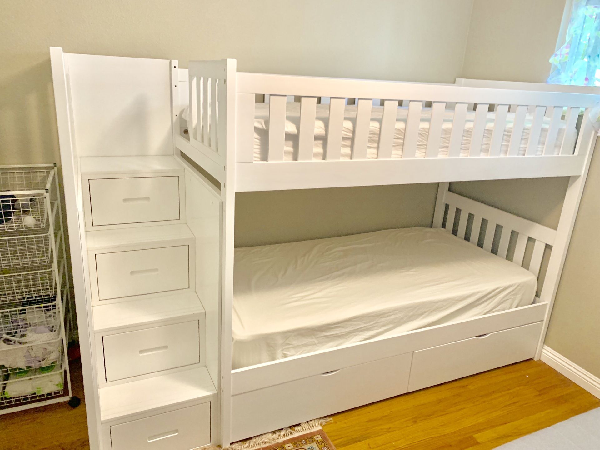White twin bunk bed with storage and mattresses